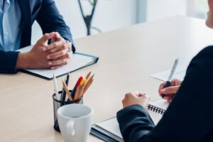 Close up interviewer interview candidate apply for job at meeting room in office.